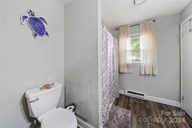 bathroom featuring a shower with shower curtain, toilet, and hardwood / wood-style floors