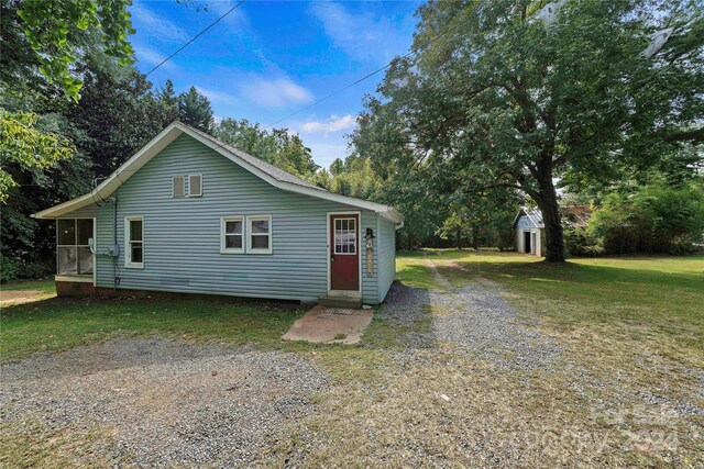 229 Friendship Dr, Ellenboro, NC 28040 - view of front facade with a sunroom and a front yard