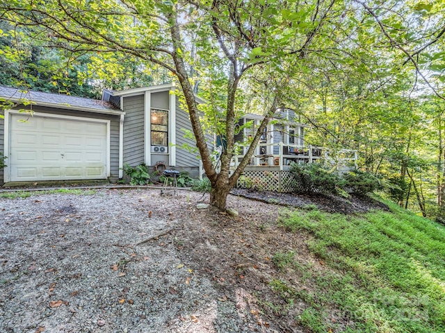 view of front of home featuring a garage and a deck