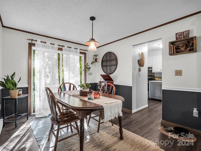 dining space featuring ornamental molding, a textured ceiling, and dark wood-type flooring