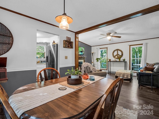 dining room featuring ceiling fan, vaulted ceiling with beams, a textured ceiling, and dark hardwood / wood-style floors