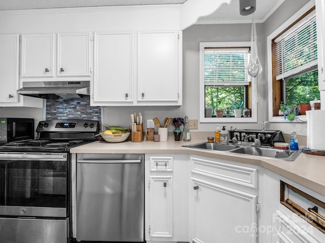 kitchen with sink, decorative light fixtures, white cabinetry, ventilation hood, and appliances with stainless steel finishes