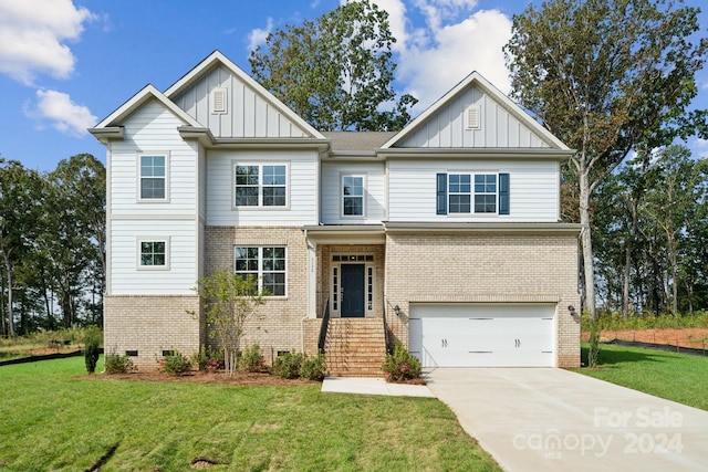 craftsman-style house featuring a front yard and a garage