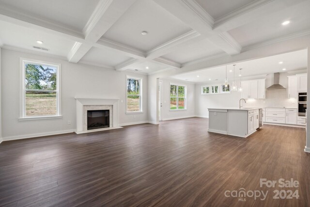 3192 Timber Run Ln, Maiden, NC 28650 - unfurnished living room with beamed ceiling, coffered ceiling, a high end fireplace, and dark wood-style flooring