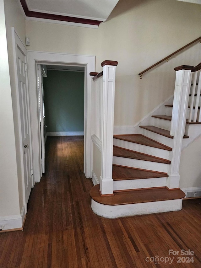 stairway featuring hardwood / wood-style flooring