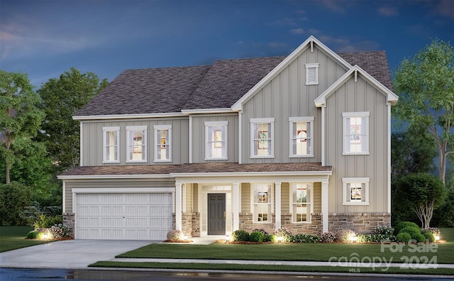 view of front facade with a front lawn and a garage