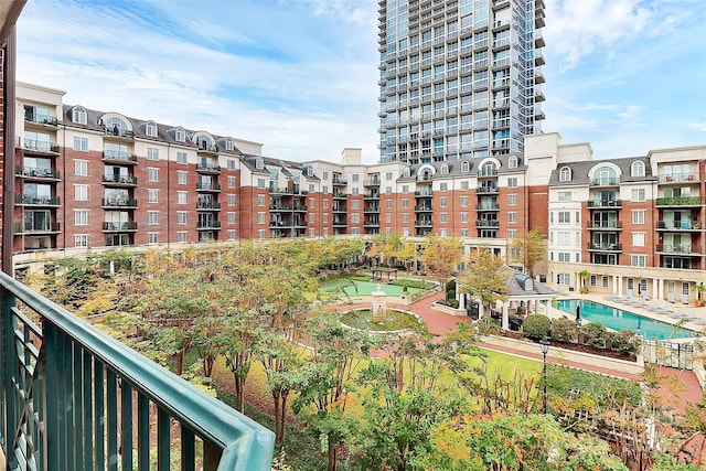 view of building exterior featuring a community pool