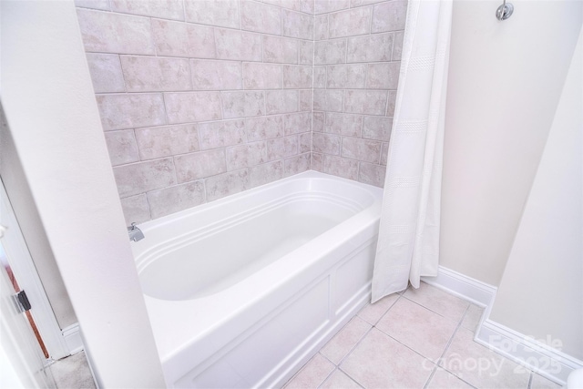 full bathroom featuring baseboards, shower / bath combo, and tile patterned floors