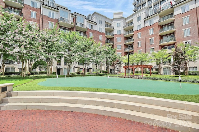 view of home's community with a pergola