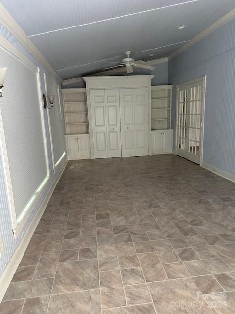 interior space featuring crown molding and vaulted ceiling