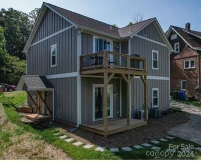 rear view of house with a balcony