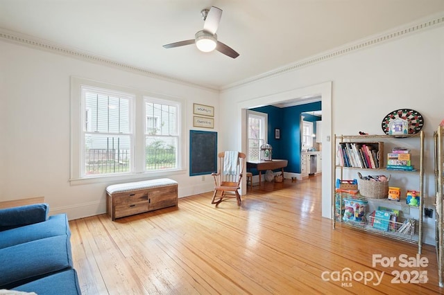 sitting room featuring ornamental molding, ceiling fan, and light hardwood / wood-style floors