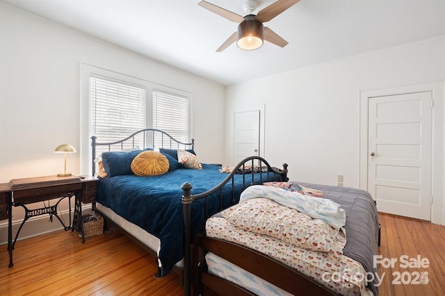 bedroom featuring hardwood / wood-style flooring and ceiling fan