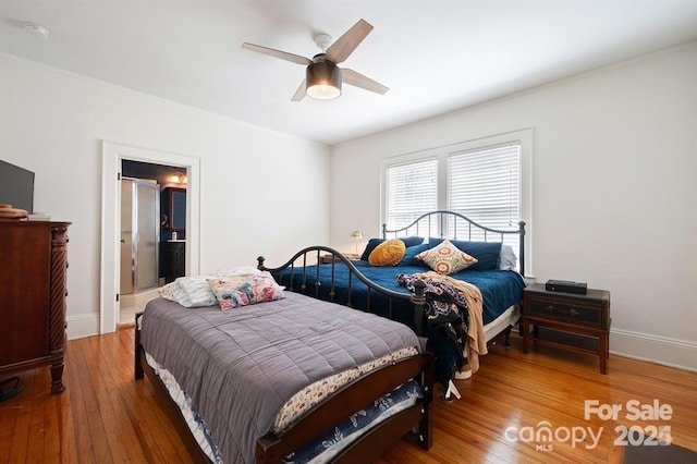 bedroom with hardwood / wood-style flooring and ceiling fan