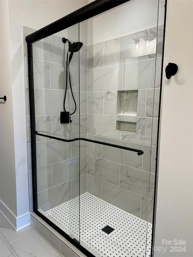 bathroom featuring an enclosed shower