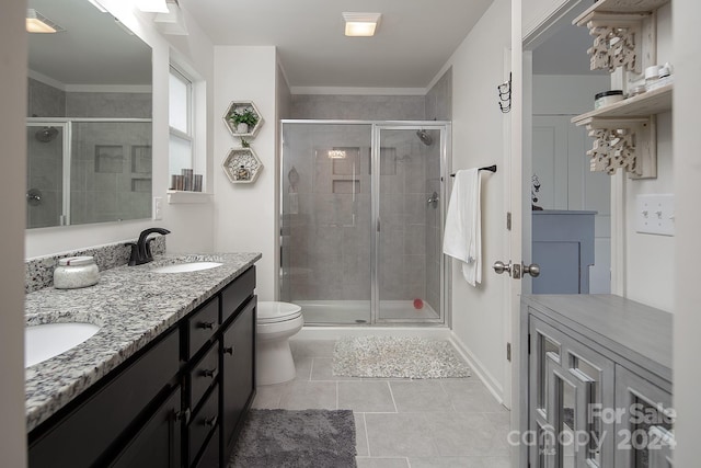 bathroom with an enclosed shower, tile patterned floors, toilet, vanity, and ornamental molding