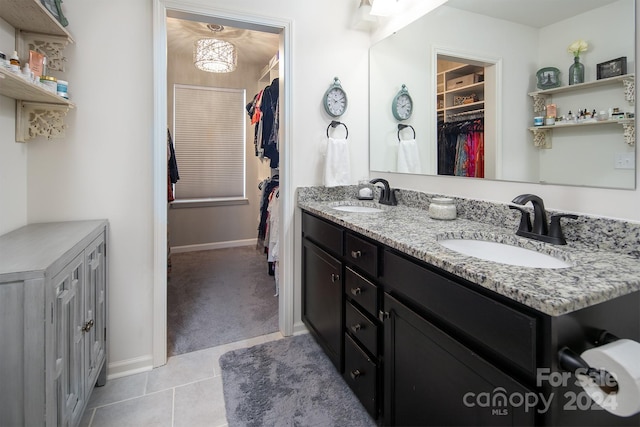 bathroom with tile patterned flooring and vanity