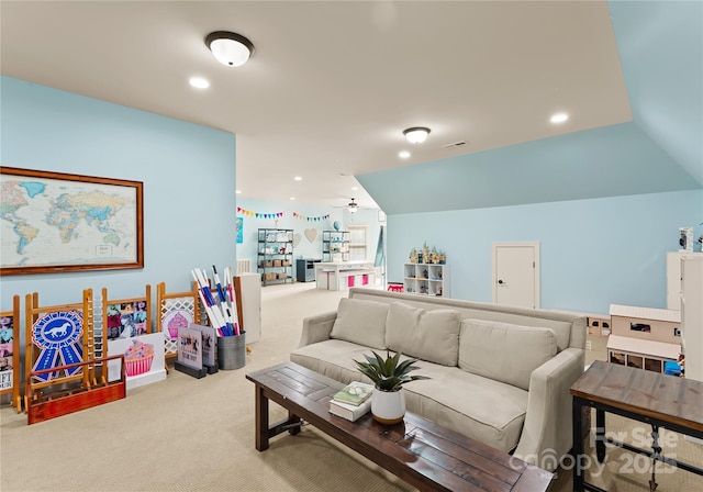 carpeted living room featuring lofted ceiling and ceiling fan