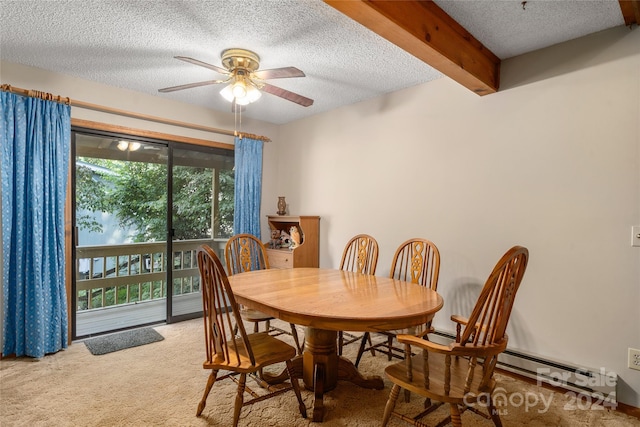 dining space featuring carpet, ceiling fan, beam ceiling, and a textured ceiling