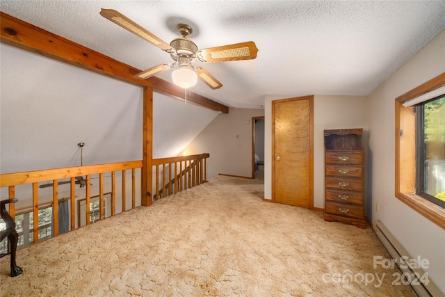 spare room with a textured ceiling, carpet flooring, ceiling fan, and lofted ceiling with beams