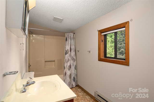 bathroom with vanity, shower / bathtub combination with curtain, and a textured ceiling