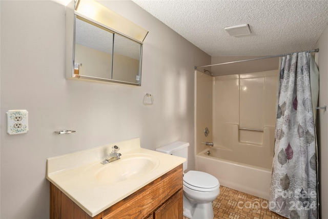 full bathroom with shower / bath combo, toilet, a textured ceiling, and vanity