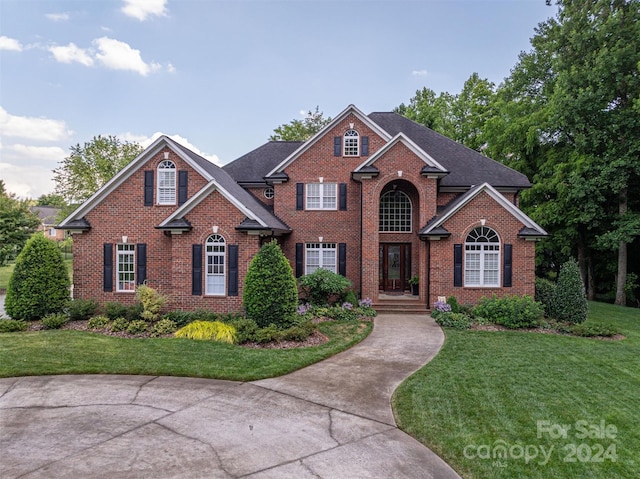 view of property featuring a front yard