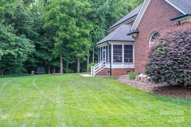 view of yard with a sunroom