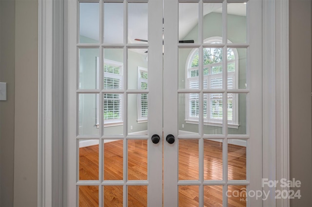 doorway featuring hardwood / wood-style floors and plenty of natural light