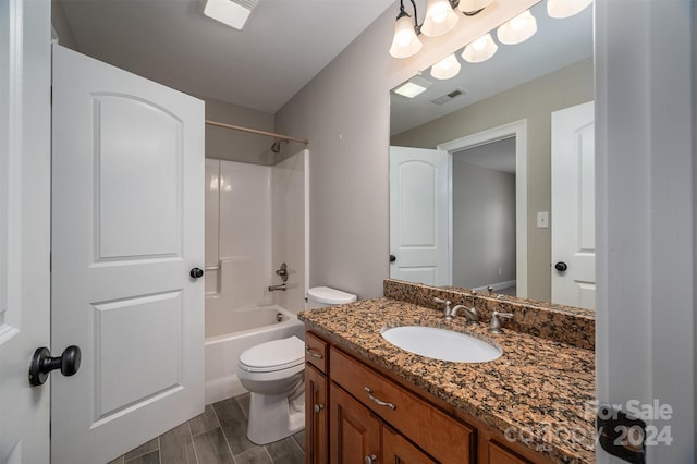 full bathroom featuring toilet, vanity, wood-type flooring, and tub / shower combination