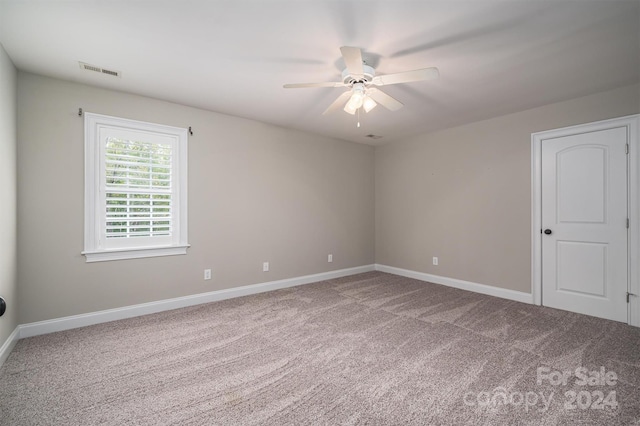 unfurnished room featuring carpet flooring and ceiling fan