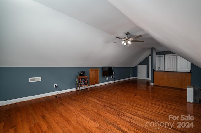 additional living space featuring ceiling fan, wood-type flooring, and vaulted ceiling