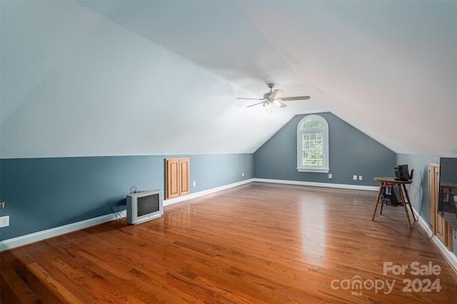 bonus room featuring lofted ceiling, hardwood / wood-style flooring, and ceiling fan