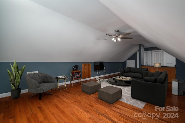 living room featuring vaulted ceiling, hardwood / wood-style flooring, and ceiling fan