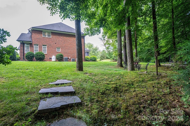 view of yard featuring central AC