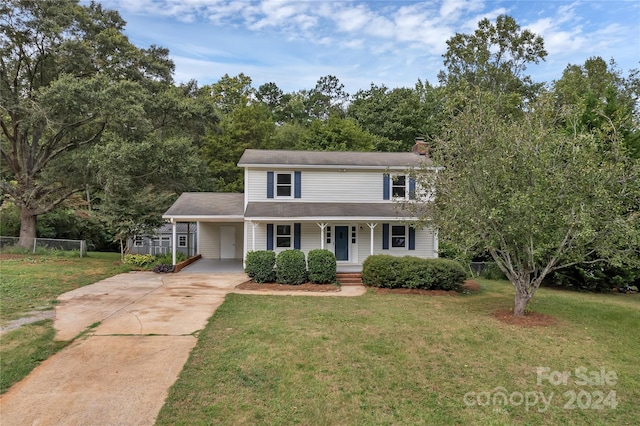 view of front facade with a front lawn and covered porch