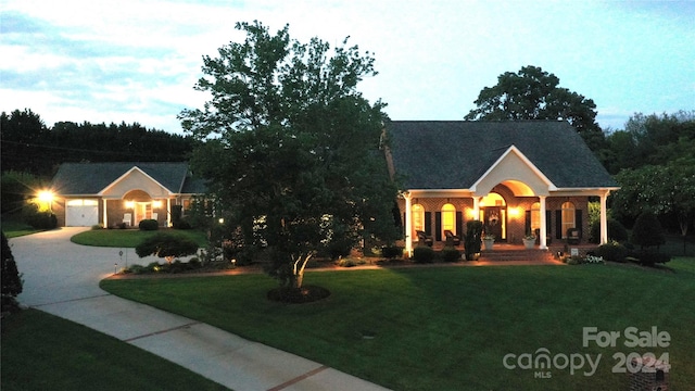 view of front of home featuring a lawn and a porch