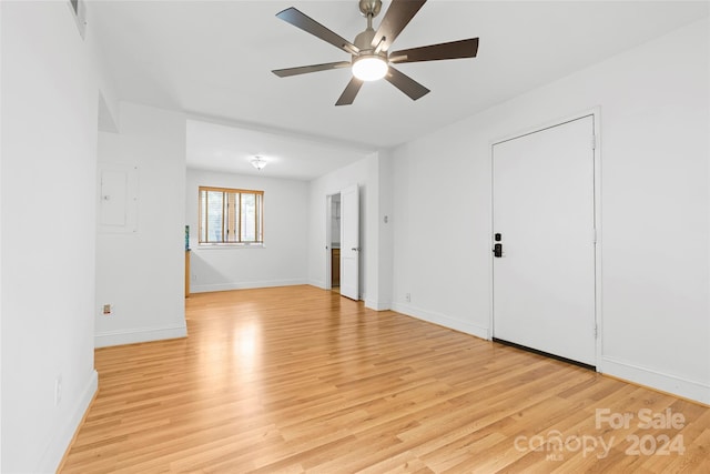 spare room featuring light wood-type flooring and ceiling fan