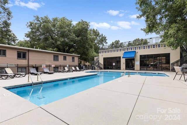 view of pool featuring a patio