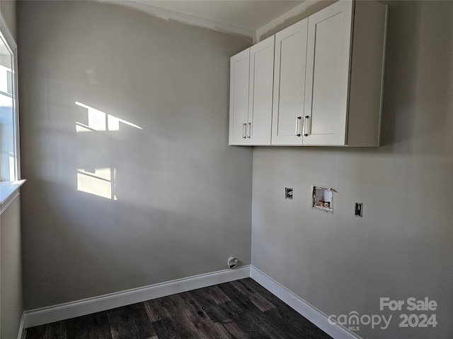 washroom with cabinets, hookup for a washing machine, dark hardwood / wood-style flooring, and a healthy amount of sunlight