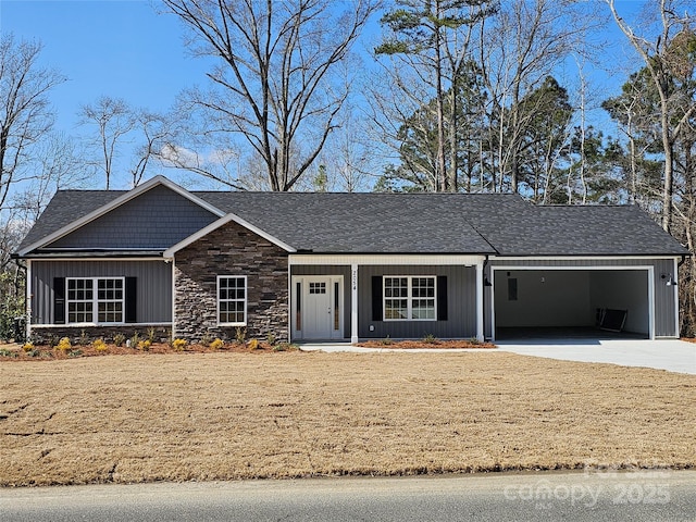 ranch-style home featuring a porch and a garage