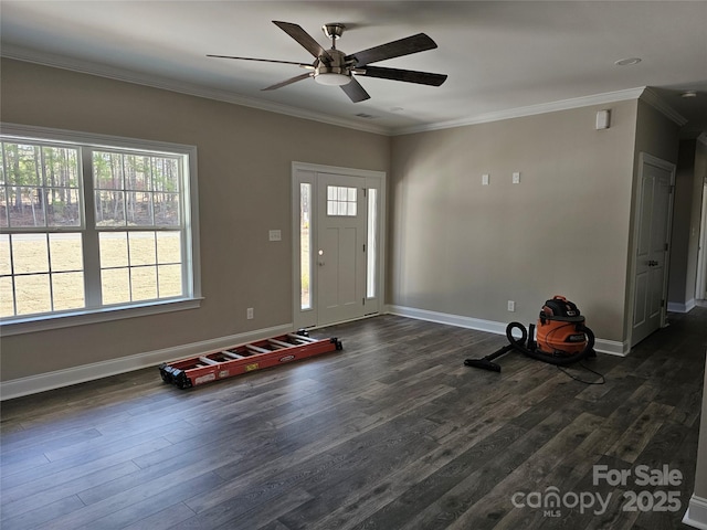 entryway with crown molding, dark wood-type flooring, and ceiling fan