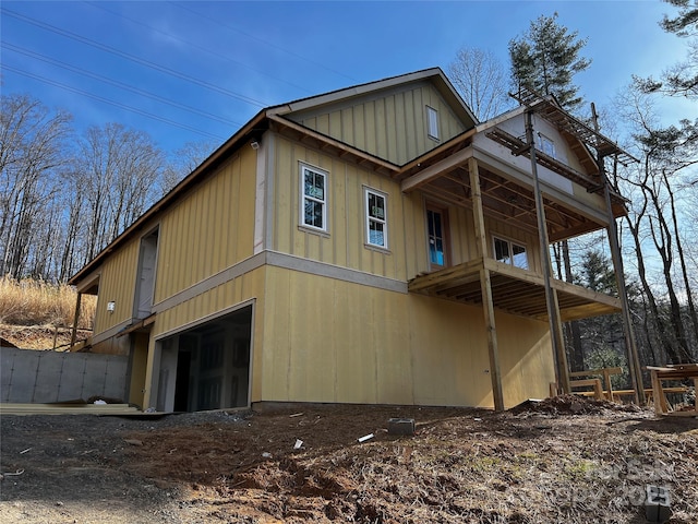 view of side of home with a garage