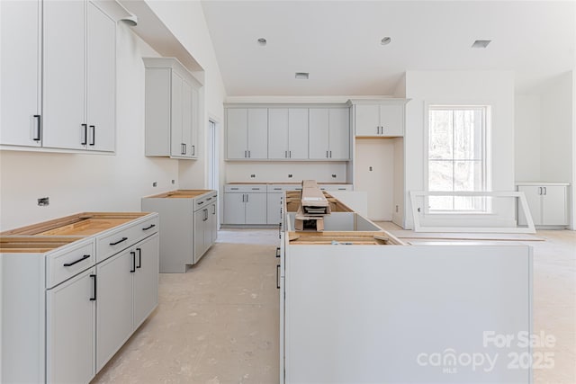 kitchen featuring white cabinets and a kitchen island