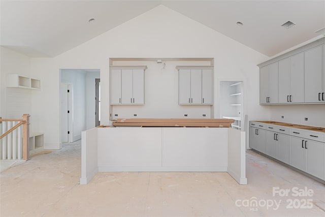 kitchen with high vaulted ceiling