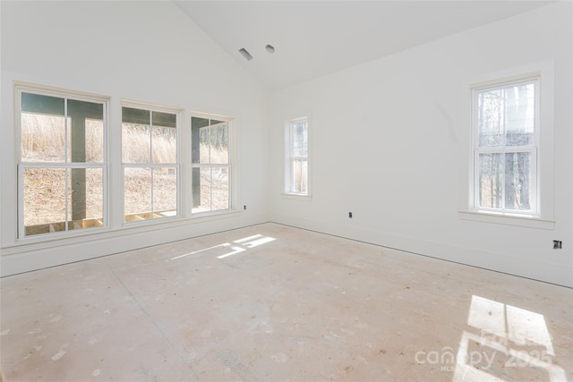 empty room featuring high vaulted ceiling