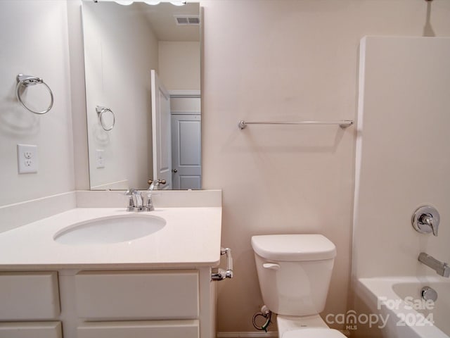 full bathroom featuring vanity, bathing tub / shower combination, and toilet