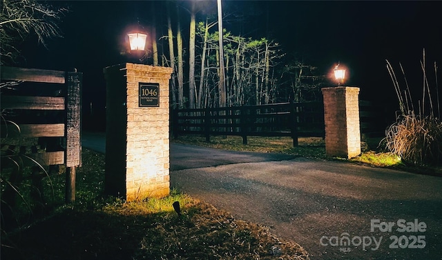 gate at night with fence