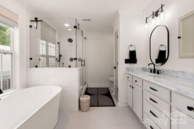 bathroom with a shower stall, crown molding, toilet, a soaking tub, and vanity