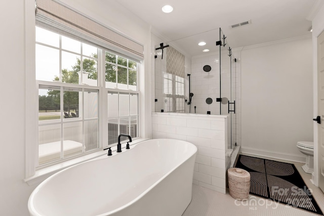 bathroom featuring visible vents, toilet, a stall shower, recessed lighting, and a soaking tub